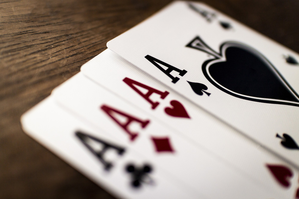 4 ace playing cards close-up on a wooden table